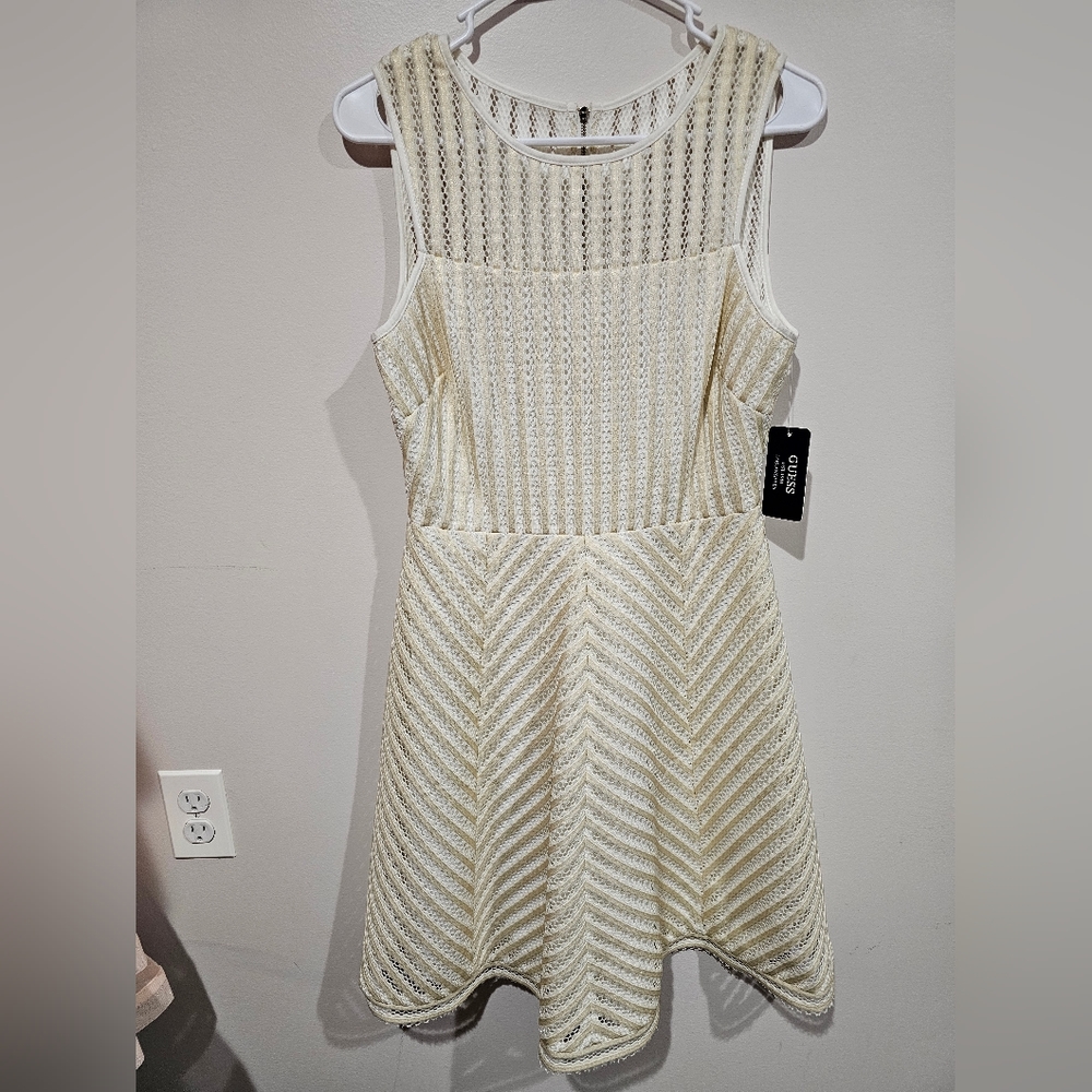 Guess Stripe Illusion Fit and Flare midi length, high neckline,a zipper closure.